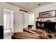 This office features a wood desk, a decorative airplane propeller and access to a bathroom at 5908 Marbrisas Ln, Las Vegas, NV 89130