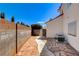 A side yard with stone pavers and landscaping at 5908 Marbrisas Ln, Las Vegas, NV 89130