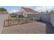Large backyard with a patio and artificial grass, perfect for outdoor activities at 6138 Crystal Flower Way, North Las Vegas, NV 89031