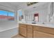 Bathroom featuring double sinks, tile flooring, and a separate shower at 6138 Crystal Flower Way, North Las Vegas, NV 89031
