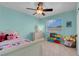 Bright bedroom with a ceiling fan, a window and decor accents at 6138 Crystal Flower Way, North Las Vegas, NV 89031