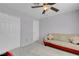 Spacious bedroom features a ceiling fan, carpeted floors and a cozy sitting area at 6138 Crystal Flower Way, North Las Vegas, NV 89031