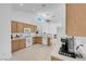 Bright kitchen with ample counter space, light wood cabinets, white appliances, and large window at 6138 Crystal Flower Way, North Las Vegas, NV 89031