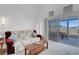 Bright living room with high ceilings, a sliding glass door, and patio access at 6138 Crystal Flower Way, North Las Vegas, NV 89031