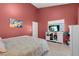 Main bedroom showcasing a window view and entertainment center at 6138 Crystal Flower Way, North Las Vegas, NV 89031