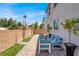 Inviting backyard with brick-paved patio and comfortable outdoor seating; perfect for relaxation at 66 Chelsea Manor Ct, Las Vegas, NV 89110