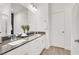 Elegant bathroom showcases dual sinks, sleek countertops, and a glass-enclosed shower at 66 Chelsea Manor Ct, Las Vegas, NV 89110
