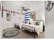 Nautical-themed bedroom with two twin beds, fun decor, and a welcoming atmosphere at 66 Chelsea Manor Ct, Las Vegas, NV 89110