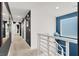 Upstairs hallway with stylish decor, leading to bedrooms and the laundry room at 66 Chelsea Manor Ct, Las Vegas, NV 89110