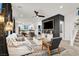 Open concept living room featuring modern decor, a ceiling fan and easy access to kitchen and stairs at 66 Chelsea Manor Ct, Las Vegas, NV 89110
