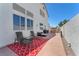 Backyard patio area with comfortable seating, grill, and landscaped surroundings at 690 Great Dane Ct, Henderson, NV 89052
