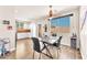 Cozy dining area adjacent to the kitchen with a ceiling fan at 690 Great Dane Ct, Henderson, NV 89052