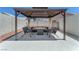 Relaxing gazebo with seating area on patio and neutral color palette, perfect for outdoor living at 690 Great Dane Ct, Henderson, NV 89052