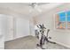 This spare room features an exercise bike, a dresser and a window at 690 Great Dane Ct, Henderson, NV 89052