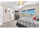 This large main bedroom has 2 windows, TV, ceiling fan and an ensuite bathroom and walk-in closet at 690 Great Dane Ct, Henderson, NV 89052