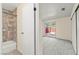 Bathroom with glass door and shower is connected to a spacious bedroom with outdoor access at 727 Heritage Vista Ave, Henderson, NV 89015