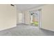 Bedroom featuring plush gray carpeting and a sliding glass door to the backyard at 727 Heritage Vista Ave, Henderson, NV 89015