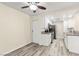 Kitchen with stainless appliances, granite counters, ceiling fan, and vinyl wood flooring at 727 Heritage Vista Ave, Henderson, NV 89015