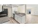 Modern kitchen featuring stainless appliances, granite counters, and access to the backyard at 727 Heritage Vista Ave, Henderson, NV 89015