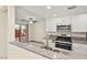Updated kitchen featuring stainless steel appliances, granite countertops, and a view to the backyard at 727 Heritage Vista Ave, Henderson, NV 89015