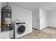 Bright laundry area with modern washer and dryer and a water heater at 727 Heritage Vista Ave, Henderson, NV 89015