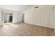 Spacious living room with sliding door access to the backyard, tile flooring, and bright natural light at 727 Heritage Vista Ave, Henderson, NV 89015