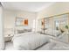 Serene main bedroom with mirrored closet, a plush bed, and a sliding glass door to a private outdoor space at 727 Heritage Vista Ave, Henderson, NV 89015