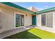 Well-lit patio featuring red trim accents and views through the sliding glass doors at 727 Heritage Vista Ave, Henderson, NV 89015