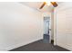 Bedroom view featuring an open doorway, neutral walls, plush carpeting, and a closet at 7288 Quarterhorse Ln, Las Vegas, NV 89148