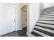 Bright foyer featuring hardwood stairs and a white front door at 7288 Quarterhorse Ln, Las Vegas, NV 89148