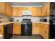 Well-lit kitchen featuring gas stove, microwave, and dishwasher at 7288 Quarterhorse Ln, Las Vegas, NV 89148