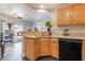 Functional kitchen featuring classic wood cabinetry and modern appliances at 7288 Quarterhorse Ln, Las Vegas, NV 89148