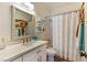 Bathroom featuring a single sink with a shower and bathtub combination at 7648 Rolling View Dr # 201, Las Vegas, NV 89149