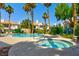 Community hot tub with pool and lush landscaping, ideal for relaxation and enjoying the outdoors at 7648 Rolling View Dr # 201, Las Vegas, NV 89149