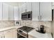 Close up of modern kitchen appliances and countertops at 7648 Rolling View Dr # 201, Las Vegas, NV 89149