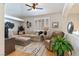 Comfortable living room features neutral tones, plantation shutters and modern furnishings at 7648 Rolling View Dr # 201, Las Vegas, NV 89149