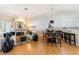 Bright living room with fireplace open to the dining area and kitchen at 7648 Rolling View Dr # 201, Las Vegas, NV 89149