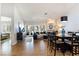 Open floor plan with bright living and dining area featuring hardwood floors and fireplace at 7648 Rolling View Dr # 201, Las Vegas, NV 89149