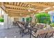 Inviting outdoor patio area with comfortable seating under a decorative pergola, perfect for relaxing and entertaining at 7648 Rolling View Dr # 201, Las Vegas, NV 89149