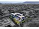Bird's eye view of an upscale home with a modern design, backyard pool, and desert landscaping at 8 Meadowhawk Ln, Las Vegas, NV 89135