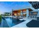 Expansive backyard with a modern pool and spa, perfect for outdoor entertaining and relaxation at 8 Meadowhawk Ln, Las Vegas, NV 89135