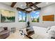 Bedroom with a corner window, beamed ceilings and walls that feature both art and words at 8 Meadowhawk Ln, Las Vegas, NV 89135