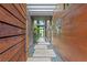 Unique entry with stone pavers, modern lighting, and sleek wood paneling at 8 Meadowhawk Ln, Las Vegas, NV 89135