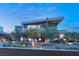 Modern home with striking architecture, manicured landscaping, and elegant lighting at 8 Meadowhawk Ln, Las Vegas, NV 89135
