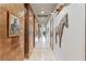 Elegant hallway with marble floors, copper accents, and unique art pieces creating a sophisticated and inviting atmosphere at 8 Meadowhawk Ln, Las Vegas, NV 89135