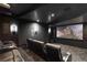 Movie theater with large screen, plush seating, and ambient lighting for immersive entertainment at 8 Meadowhawk Ln, Las Vegas, NV 89135