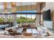 Spacious living room with modern fireplace, large TV, and a comfortable wraparound sofa at 8 Meadowhawk Ln, Las Vegas, NV 89135