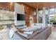 Open living room with fireplace, TV, shelving, and comfortable seating at 8 Meadowhawk Ln, Las Vegas, NV 89135