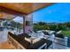 Outdoor living space offering comfortable seating, a fire pit and an infinity pool with mountain views at 8 Meadowhawk Ln, Las Vegas, NV 89135