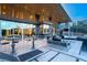 Stunning outdoor space with ample seating, bar, and access to the home's stylish interior at 8 Meadowhawk Ln, Las Vegas, NV 89135